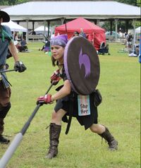 Phoenix Nightthorne at Armageddon 2026, wielding her glaive 'Fear'